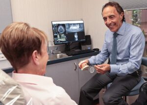 Periodontist with patient at Sarasota Periodontal Associates