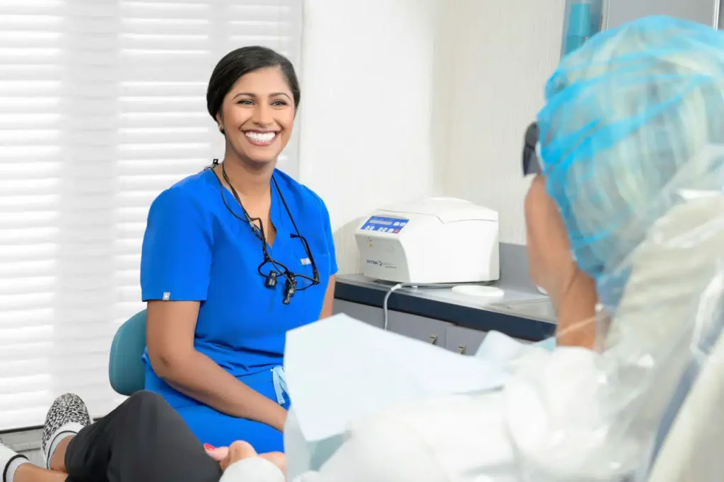 Periodontist with patient at Sarasota Periodontal Associates